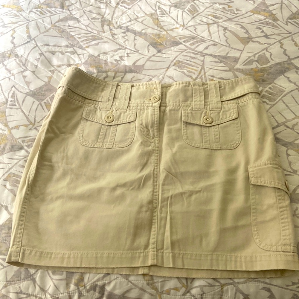 Beige skirt .